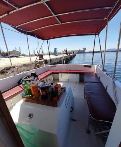 Back seats under bimini tent on boat for small group tours and private excursions from Opatija, with drinks available