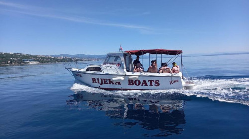 Side view of our boat cruising the Adriatic Sea, used for private tours and small group boat tours from Opatija