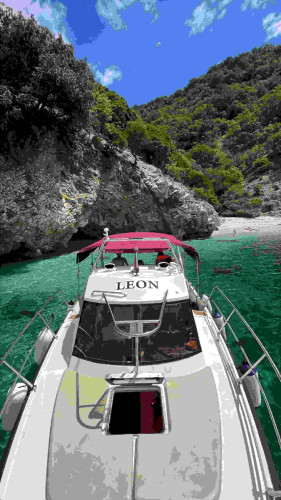 Motorboat “LEON” Anchored in a Secluded Cove